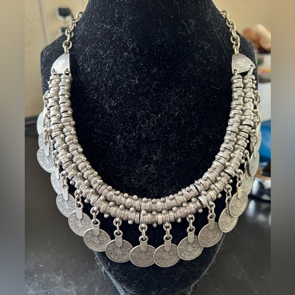 Silver antique finish coin choker with multiple layers metal beads and coins.